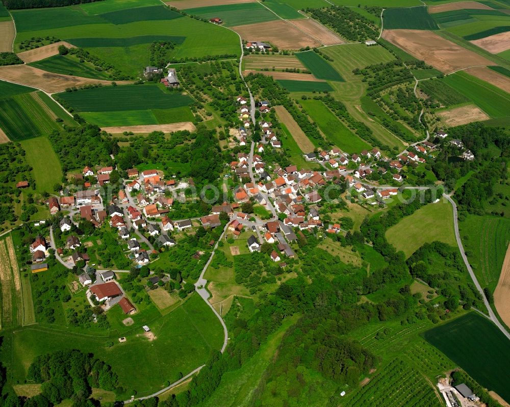 Unterschöntal from the bird's eye view: Agricultural land and field boundaries surround the settlement area of the village in Unterschöntal in the state Baden-Wuerttemberg, Germany