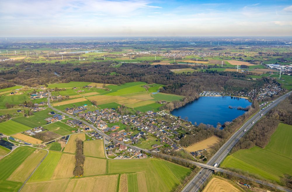 Vehlingen from above - Agricultural land and field boundaries surround the settlement area of the village in Vehlingen in the state North Rhine-Westphalia, Germany