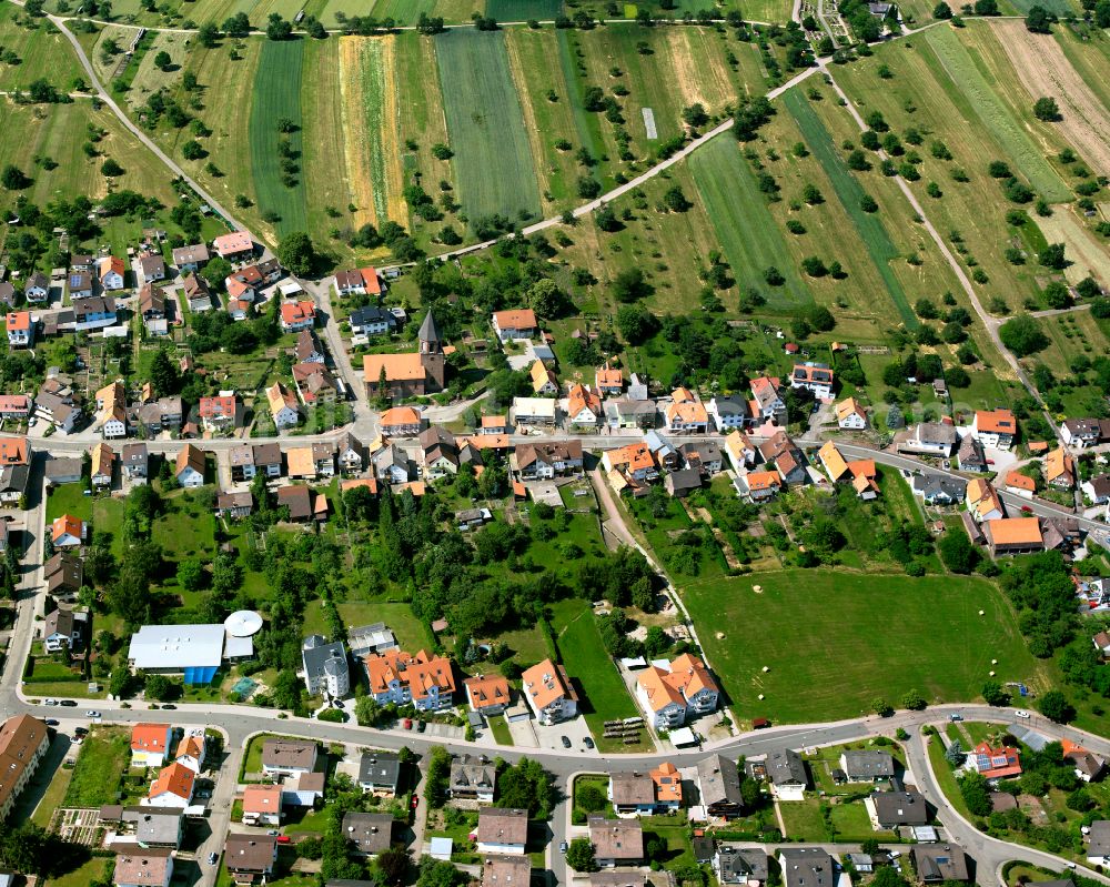 Völkersbach from the bird's eye view: Agricultural land and field boundaries surround the settlement area of the village in Völkersbach in the state Baden-Wuerttemberg, Germany