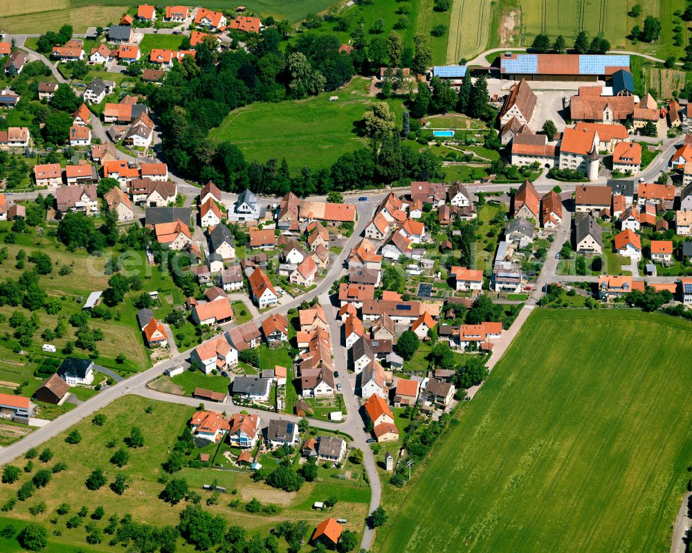Wachendorf from the bird's eye view: Agricultural land and field boundaries surround the settlement area of the village in Wachendorf in the state Baden-Wuerttemberg, Germany