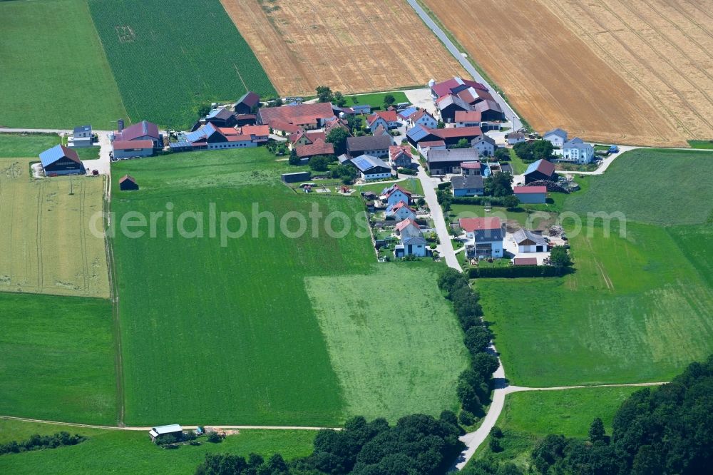 Wackersberg from the bird's eye view: Agricultural land and field boundaries surround the settlement area of the village in Wackersberg in the state Bavaria, Germany