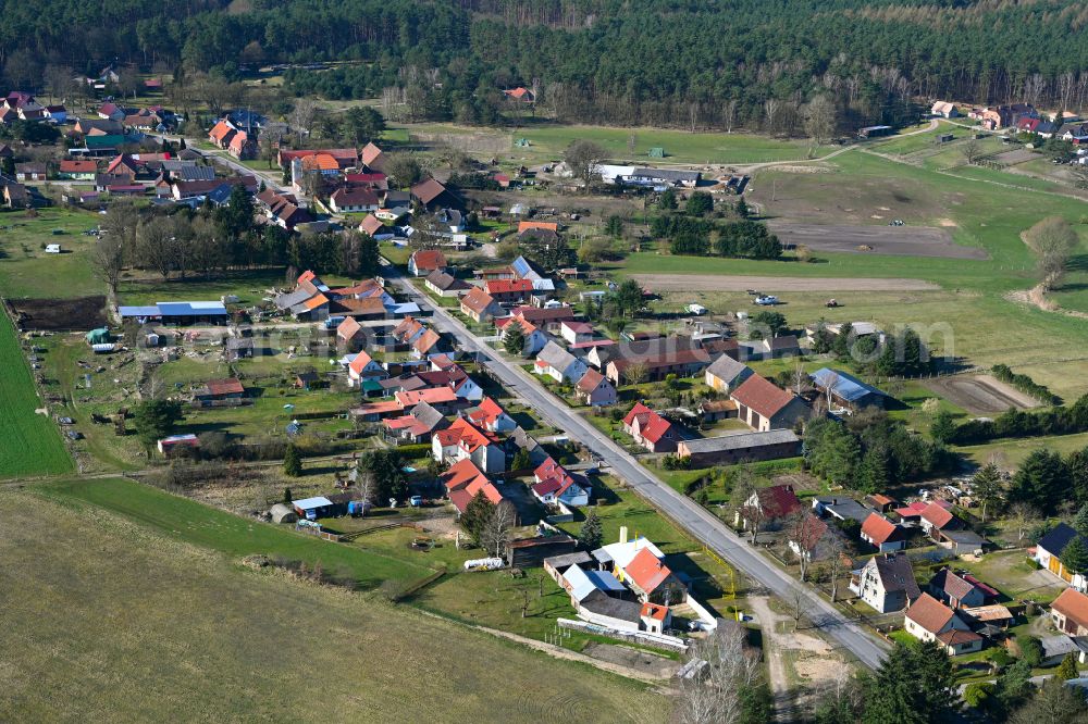 Wallitz from above - Agricultural land and field boundaries surround the settlement area of the village in Wallitz in the state Brandenburg, Germany