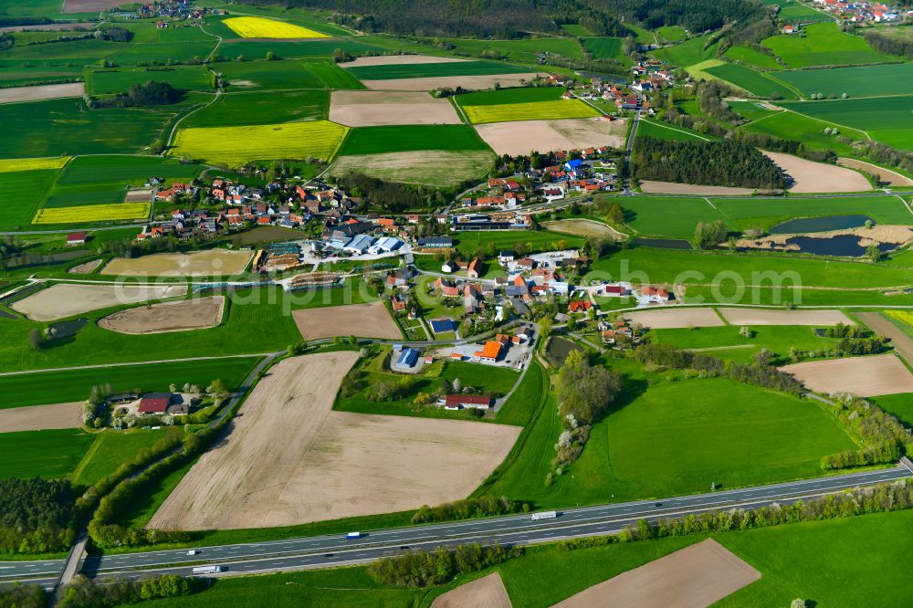Wasserberndorf from the bird's eye view: Agricultural land and field boundaries surround the settlement area of the village in Wasserberndorf in the state Bavaria, Germany
