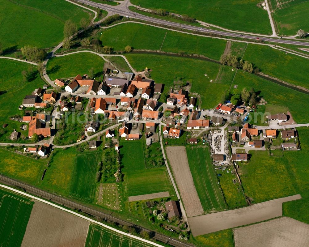 Aerial image Wasserzell - Agricultural land and field boundaries surround the settlement area of the village in Wasserzell in the state Bavaria, Germany