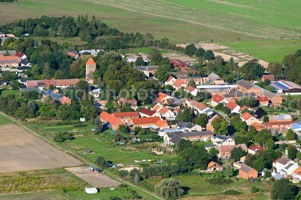 Aerial photograph Weesow - Agricultural land and field boundaries surround the settlement area of the village in Weesow in the state Brandenburg, Germany