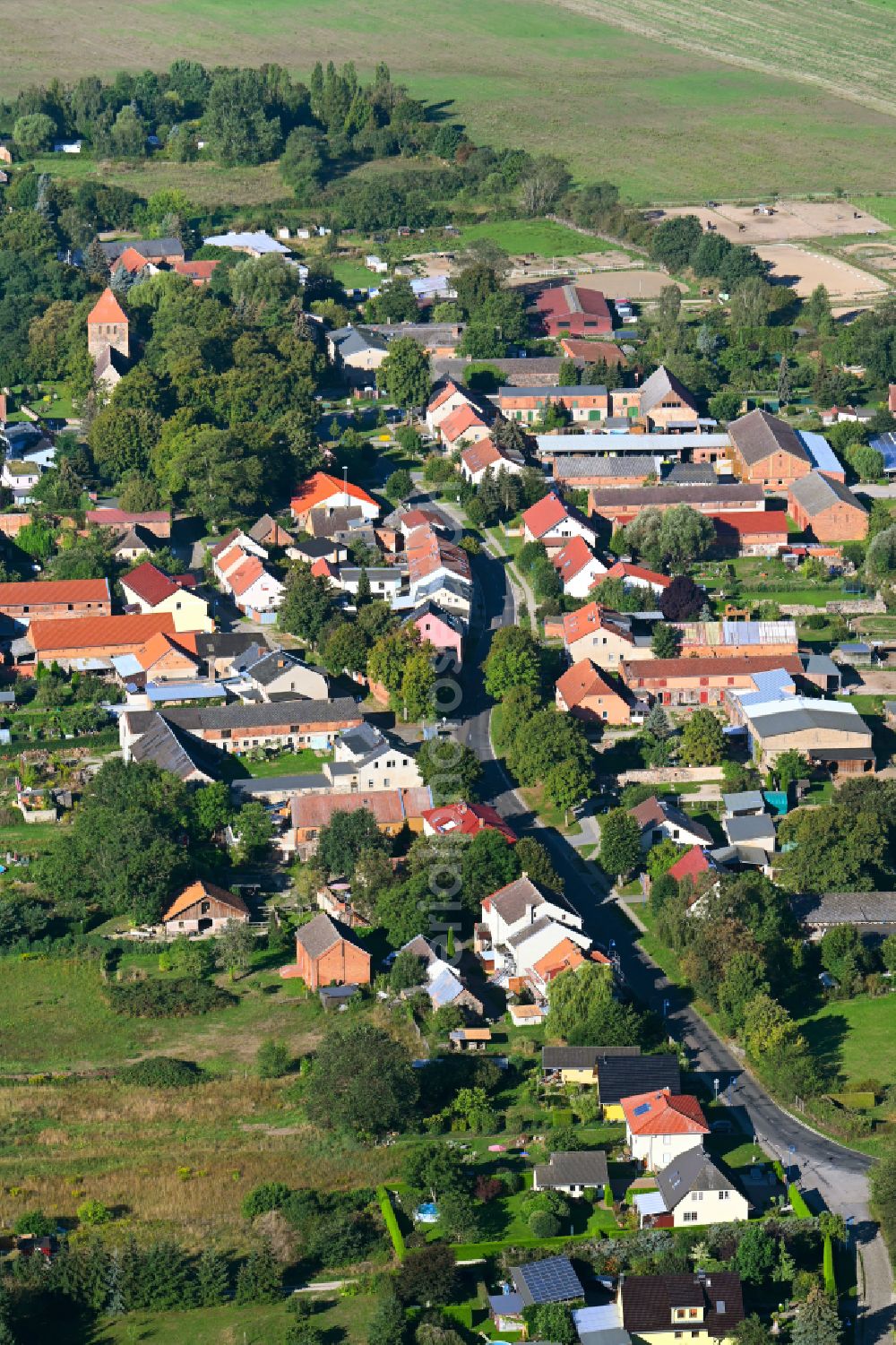 Weesow from the bird's eye view: Agricultural land and field boundaries surround the settlement area of the village in Weesow in the state Brandenburg, Germany