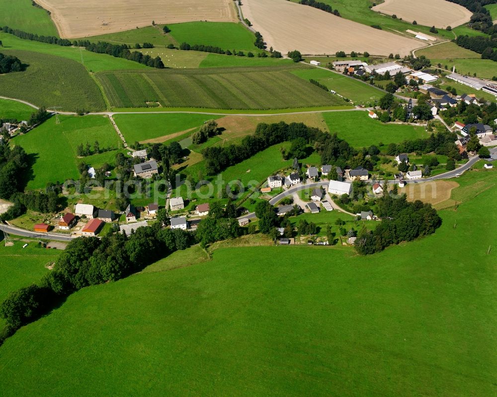 Weigmannsdorf from above - Agricultural land and field boundaries surround the settlement area of the village in Weigmannsdorf in the state Saxony, Germany