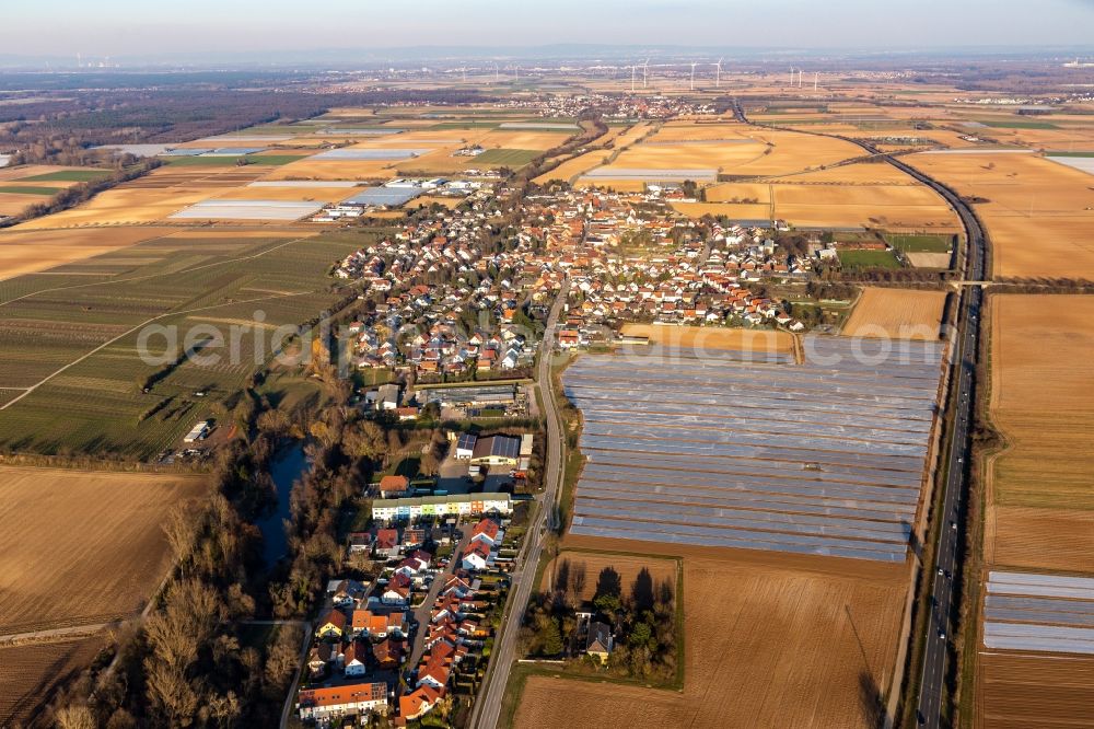 Weingarten (Pfalz) from the bird's eye view: Agricultural land and field boundaries surround the settlement area of the village in Weingarten (Pfalz) in the state Rhineland-Palatinate, Germany