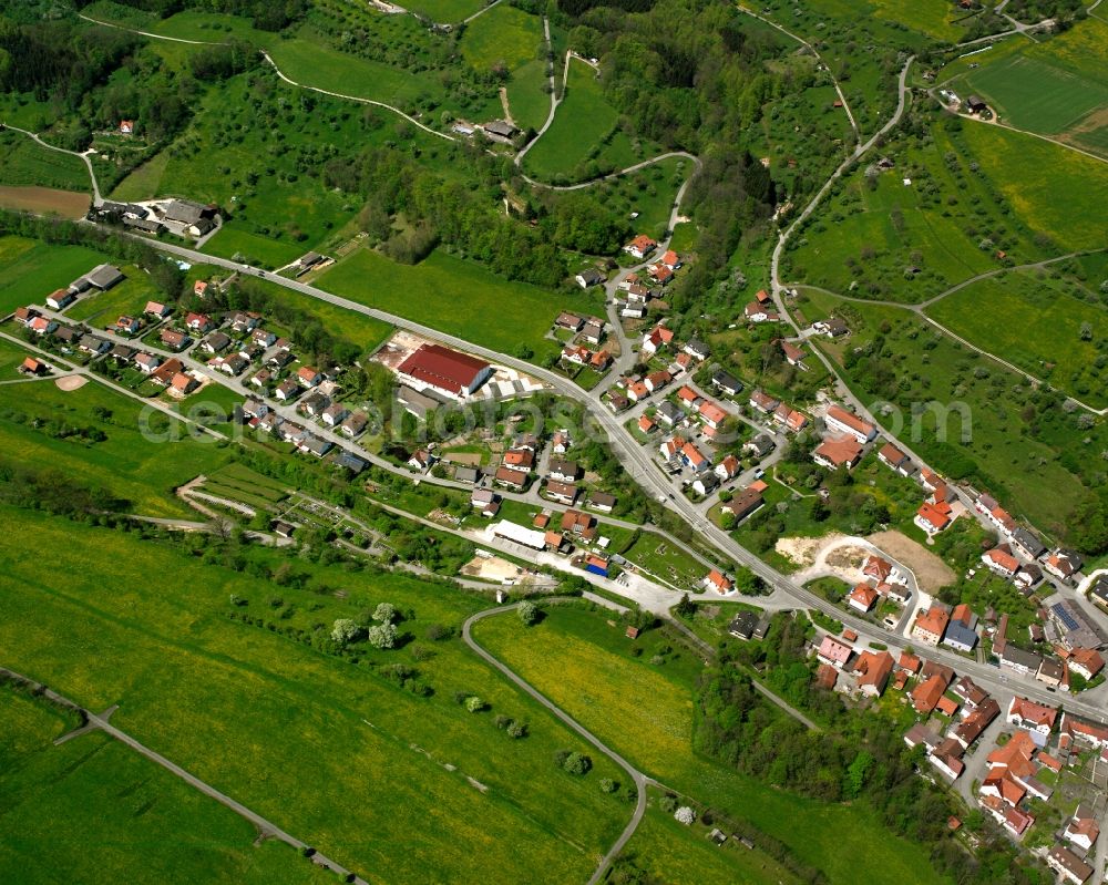 Weißenstein from the bird's eye view: Agricultural land and field boundaries surround the settlement area of the village in Weißenstein in the state Baden-Wuerttemberg, Germany