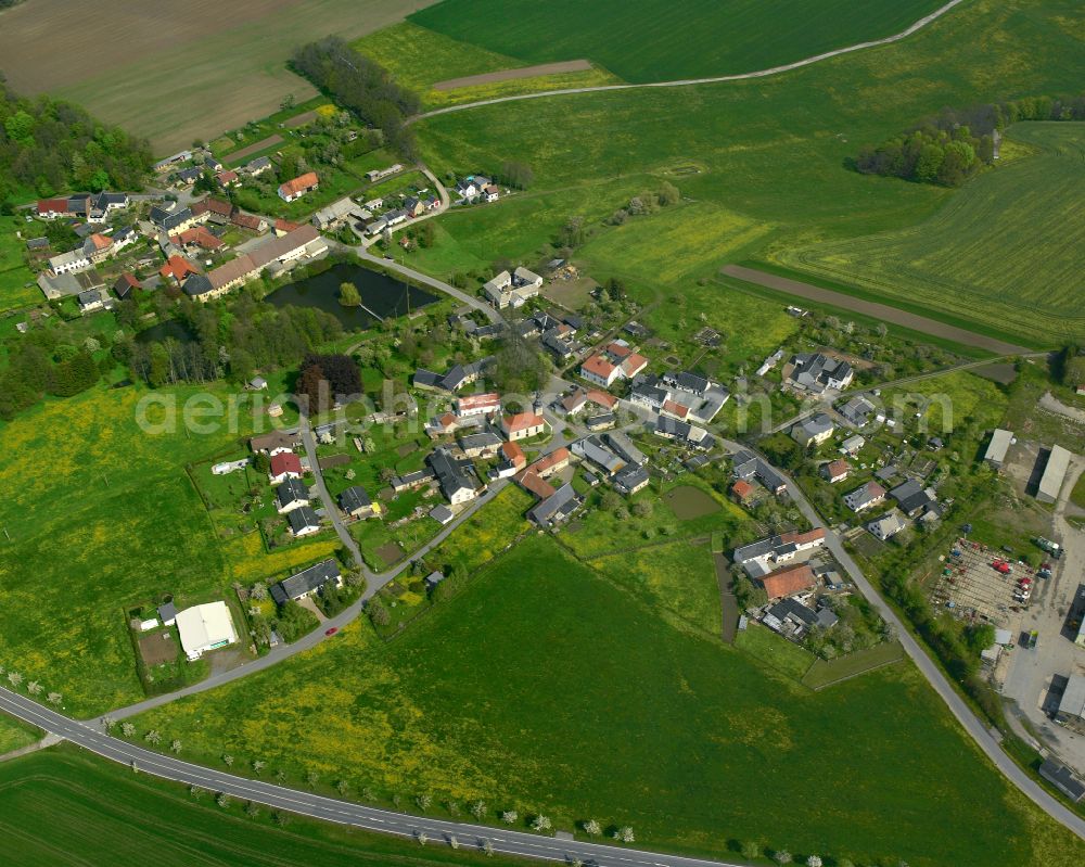 Wenigenauma from above - Agricultural land and field boundaries surround the settlement area of the village in Wenigenauma in the state Thuringia, Germany