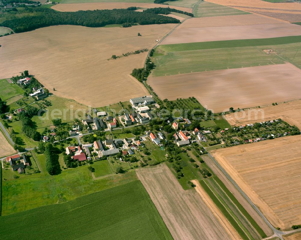 Wernsdorf from above - Agricultural land and field boundaries surround the settlement area of the village in Wernsdorf in the state Thuringia, Germany