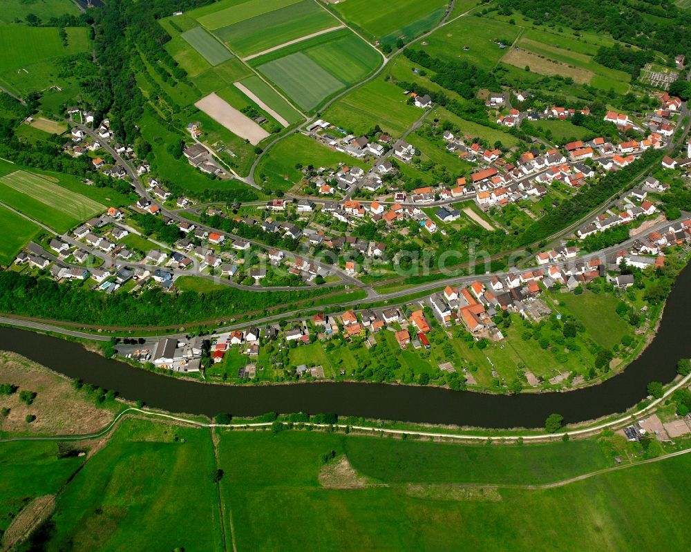 Aerial image Widdershausen - Agricultural land and field boundaries surround the settlement area of the village in Widdershausen in the state Hesse, Germany