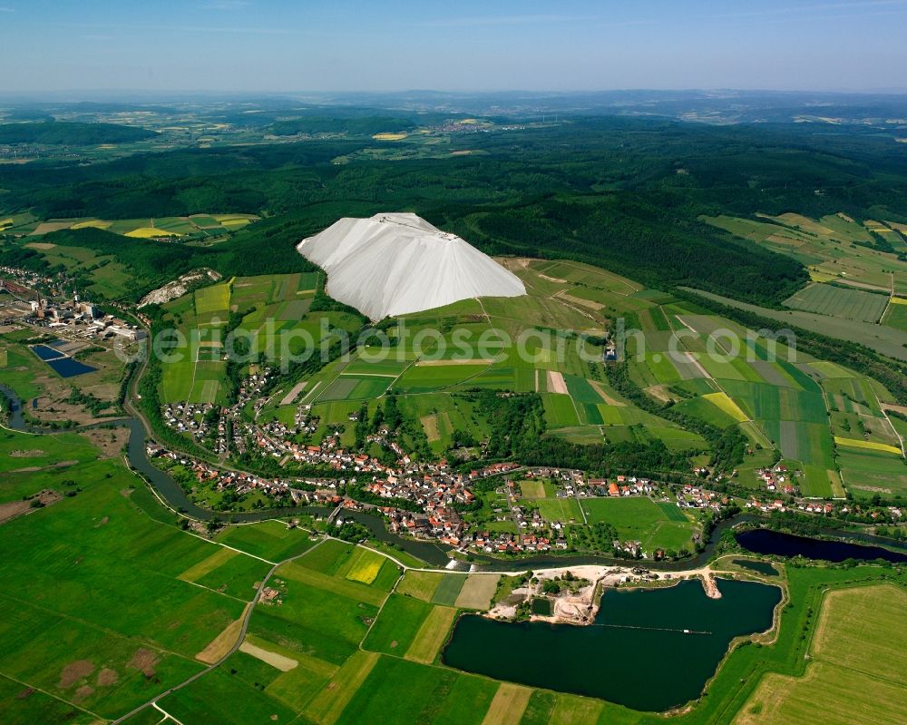 Widdershausen from above - Agricultural land and field boundaries surround the settlement area of the village in Widdershausen in the state Hesse, Germany