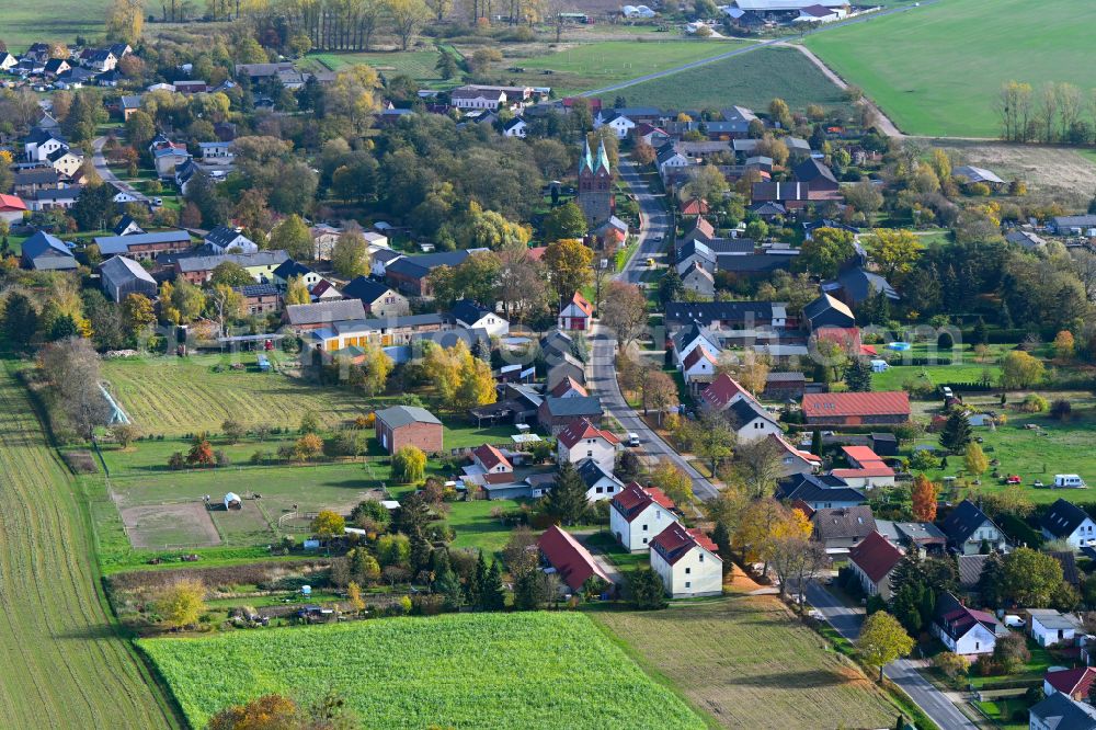 Willmersdorf from above - Agricultural land and field boundaries surround the settlement area of the village in Willmersdorf in the state Brandenburg, Germany