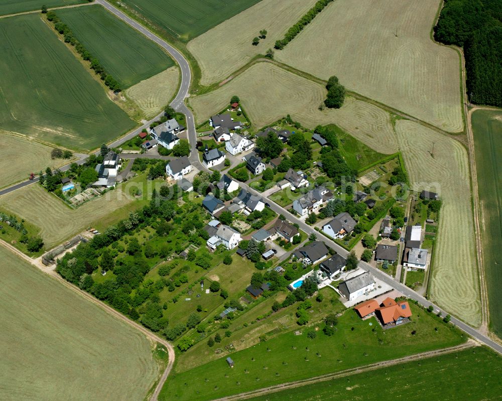 Aerial image Windhausen - Agricultural land and field boundaries surround the settlement area of the village in Windhausen in the state Rhineland-Palatinate, Germany