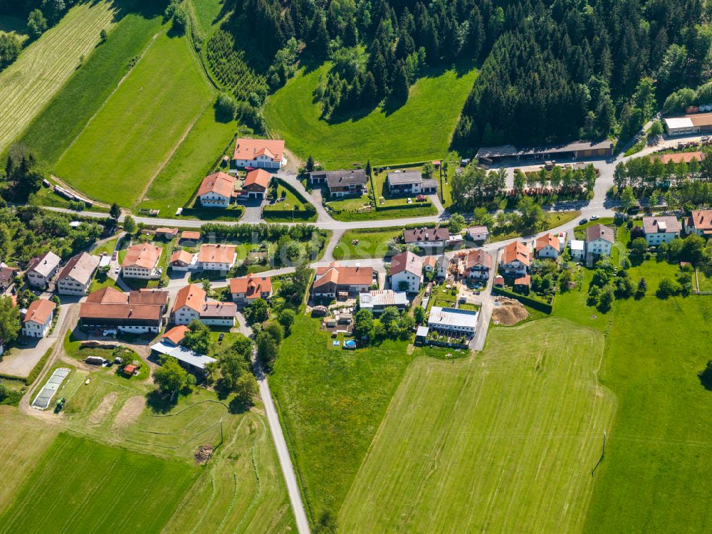Winkelbrunn from above - Agricultural land and field boundaries surround the settlement area of the village in Winkelbrunn in the state Bavaria, Germany