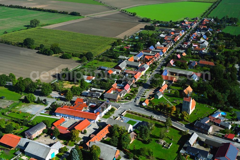 Winterfeld from the bird's eye view: Agricultural land and field boundaries surround the settlement area of the village in Winterfeld in the state Saxony-Anhalt, Germany