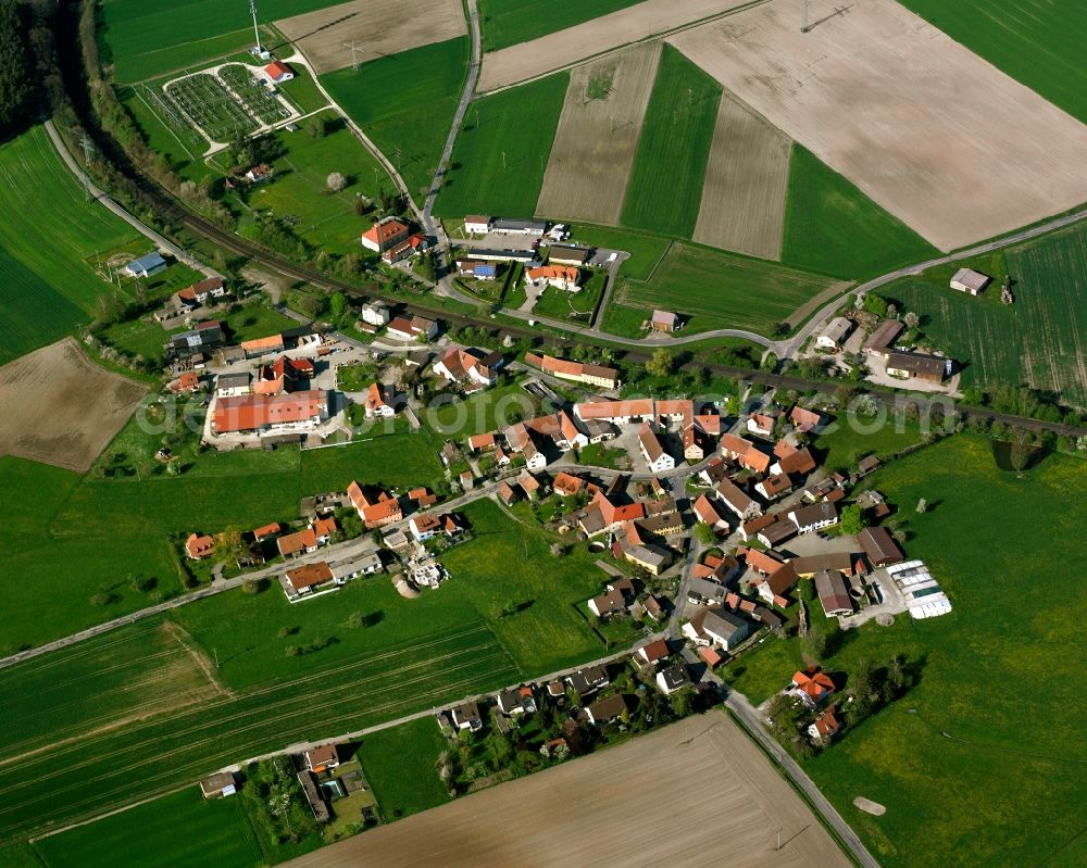 Winterschneidbach from above - Agricultural land and field boundaries surround the settlement area of the village in Winterschneidbach in the state Bavaria, Germany