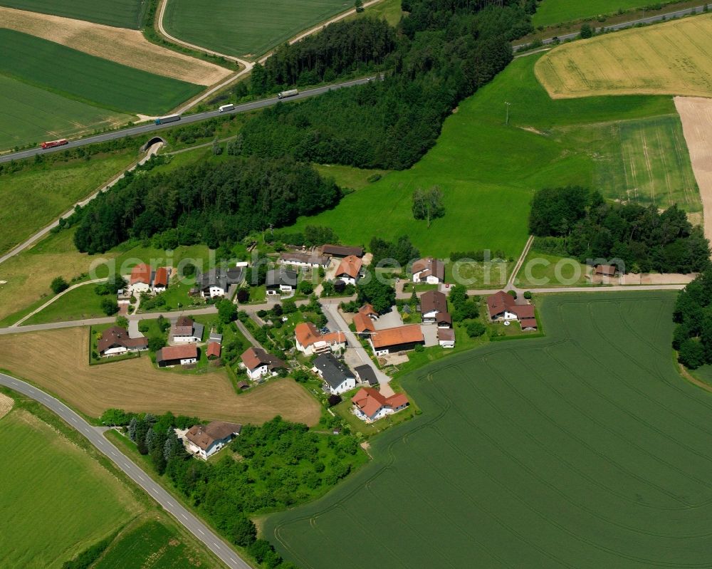 Aerial photograph Wolfsberg - Agricultural land and field boundaries surround the settlement area of the village in Wolfsberg in the state Bavaria, Germany