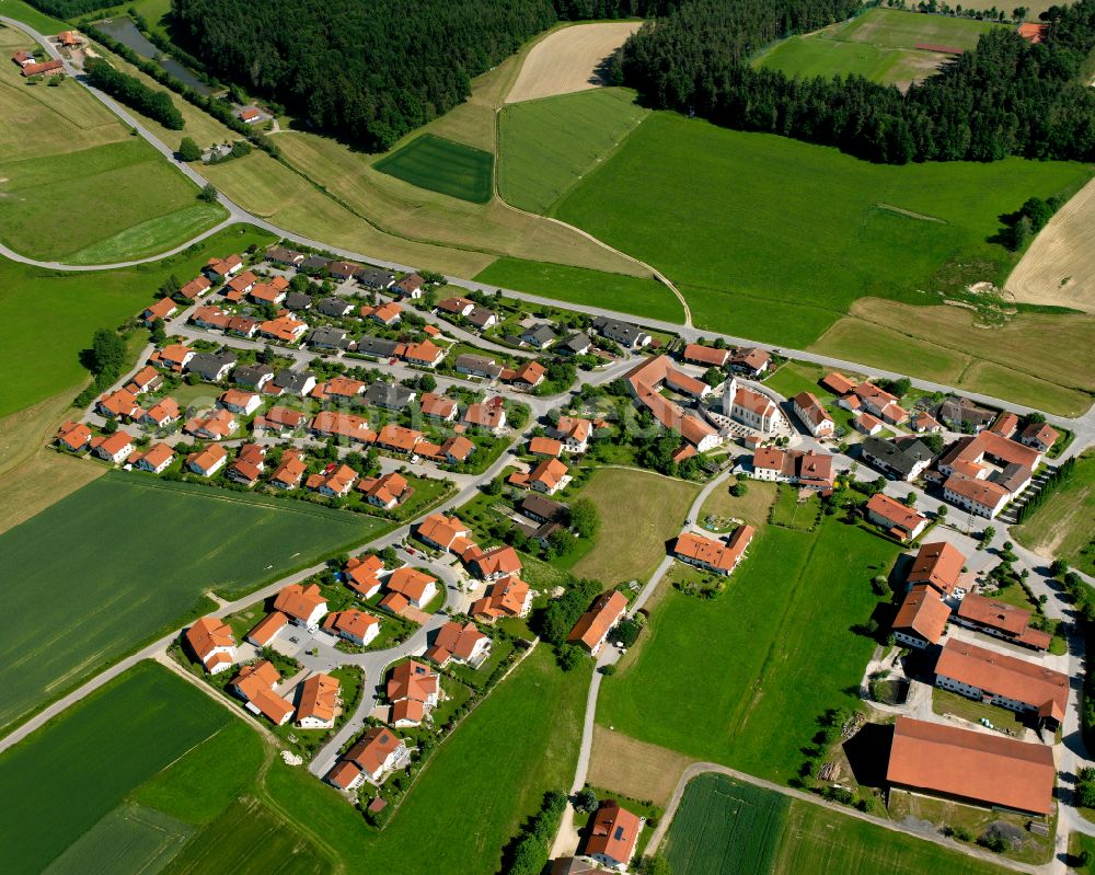 Aerial image Wolfsberg - Agricultural land and field boundaries surround the settlement area of the village in Wolfsberg in the state Bavaria, Germany