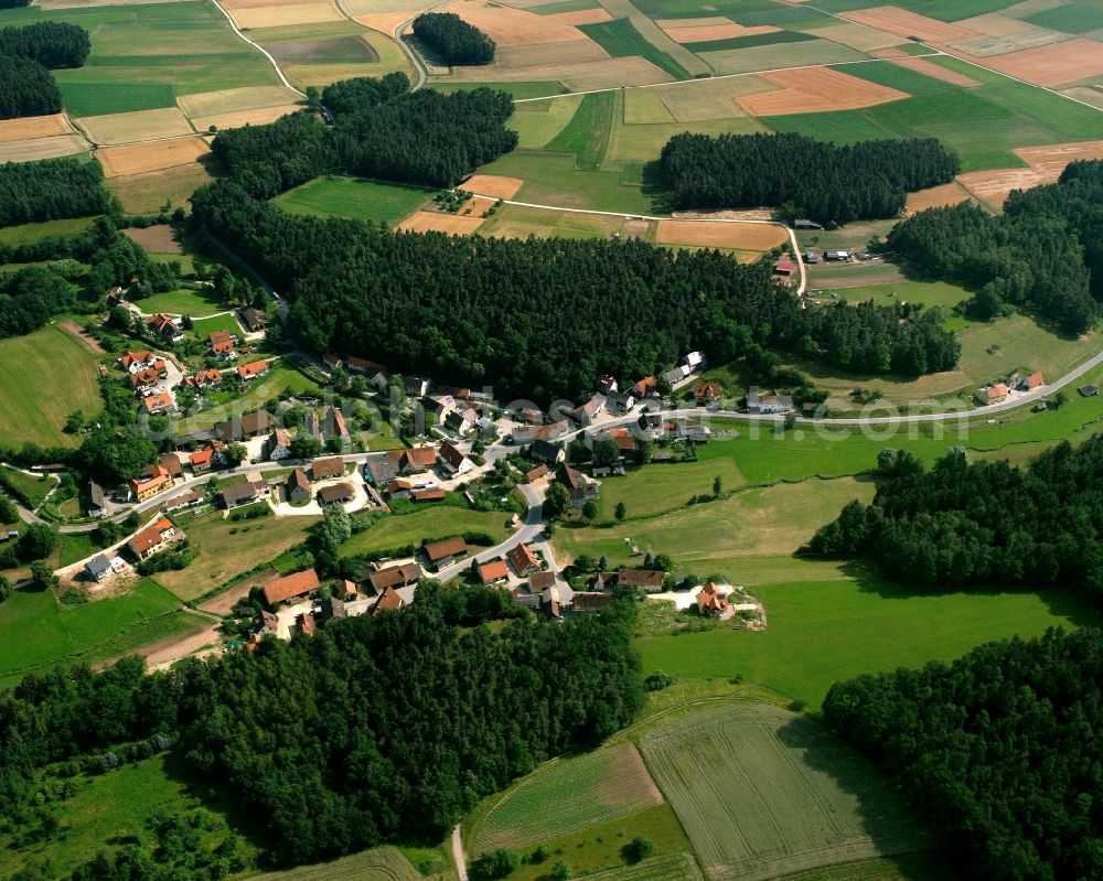 Aerial image Wollersdorf - Agricultural land and field boundaries surround the settlement area of the village in Wollersdorf in the state Bavaria, Germany
