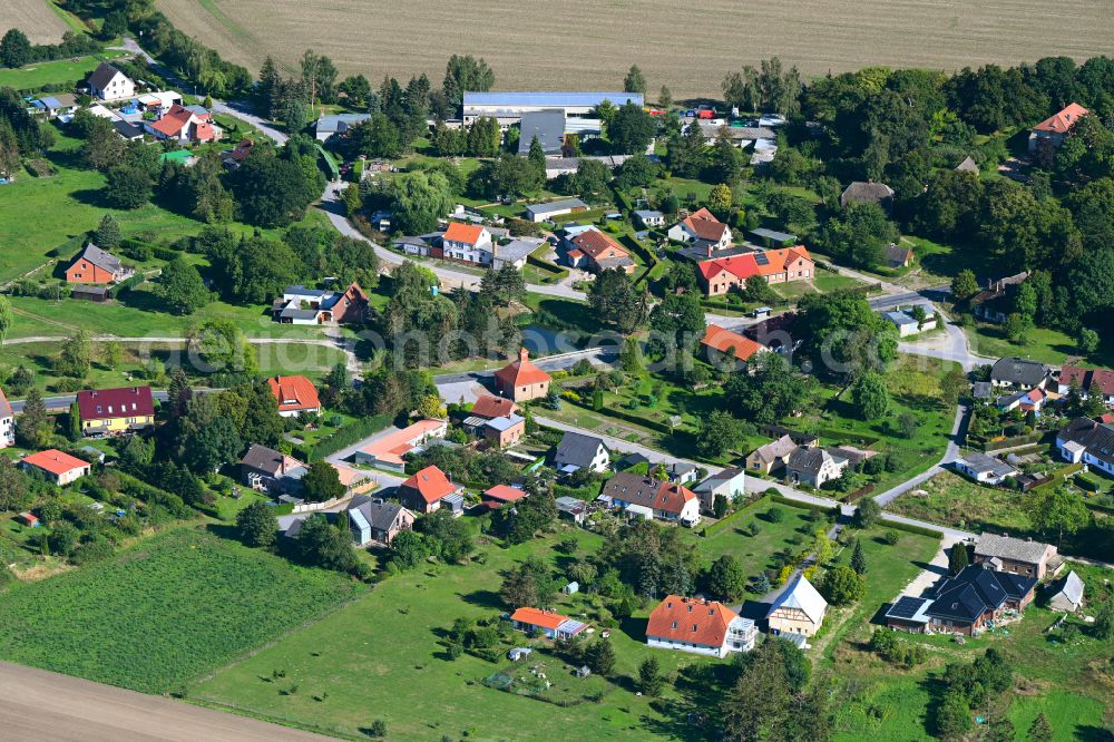 Wotenick from the bird's eye view: Agricultural land and field boundaries surround the settlement area of the village in Wotenick in the state Mecklenburg - Western Pomerania, Germany
