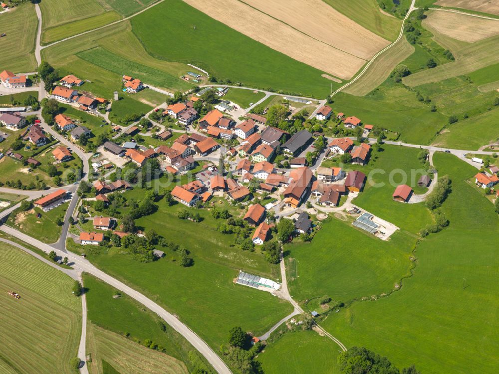 Wotzmannsreut from the bird's eye view: Agricultural land and field boundaries surround the settlement area of the village in Wotzmannsreut in the state Bavaria, Germany