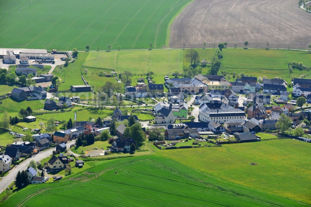 Zollgrün from the bird's eye view: Agricultural land and field boundaries surround the settlement area of the village in Zollgruen in the state Thuringia, Germany