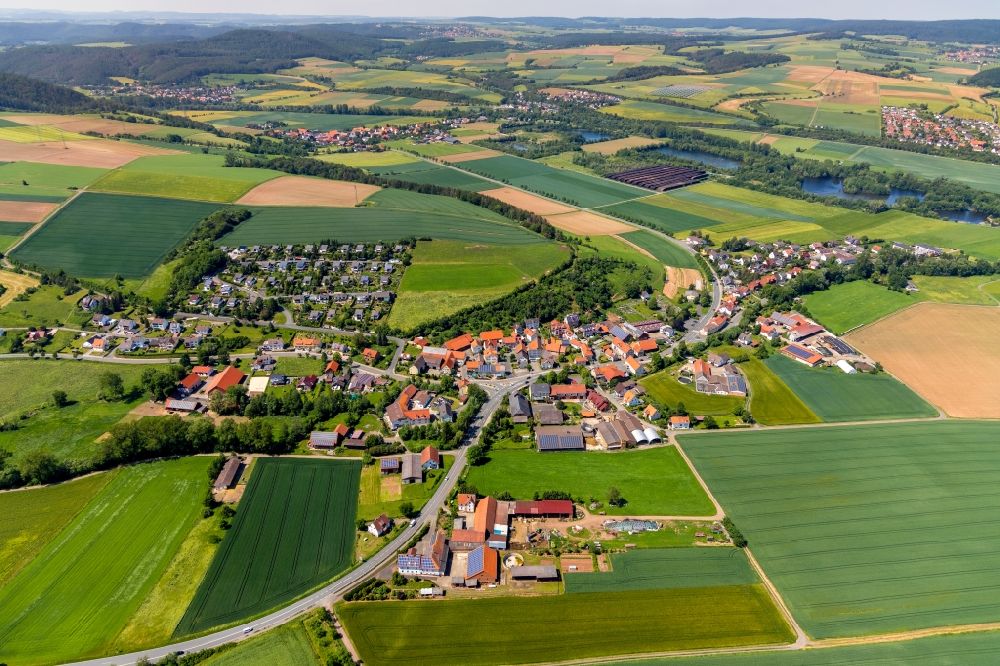 Aerial image Giflitz - Agricultural land and field borders surround the settlement area of the village in Giflitz in the state Hesse, Germany
