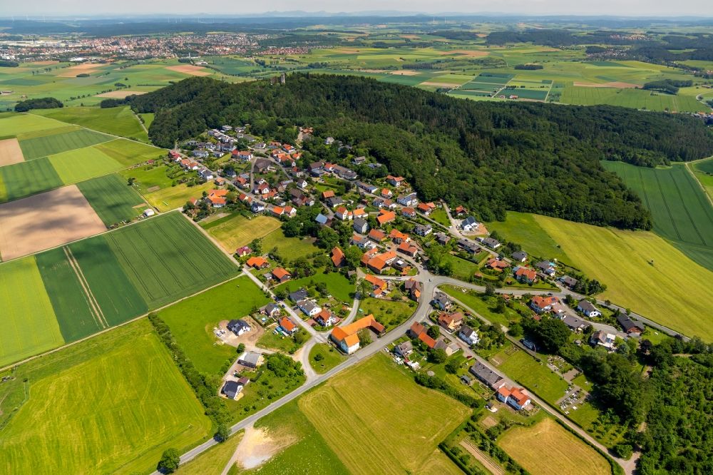 Goldhausen from above - Agricultural land and field borders surround the settlement area of the village in Goldhausen in the state Hesse, Germany