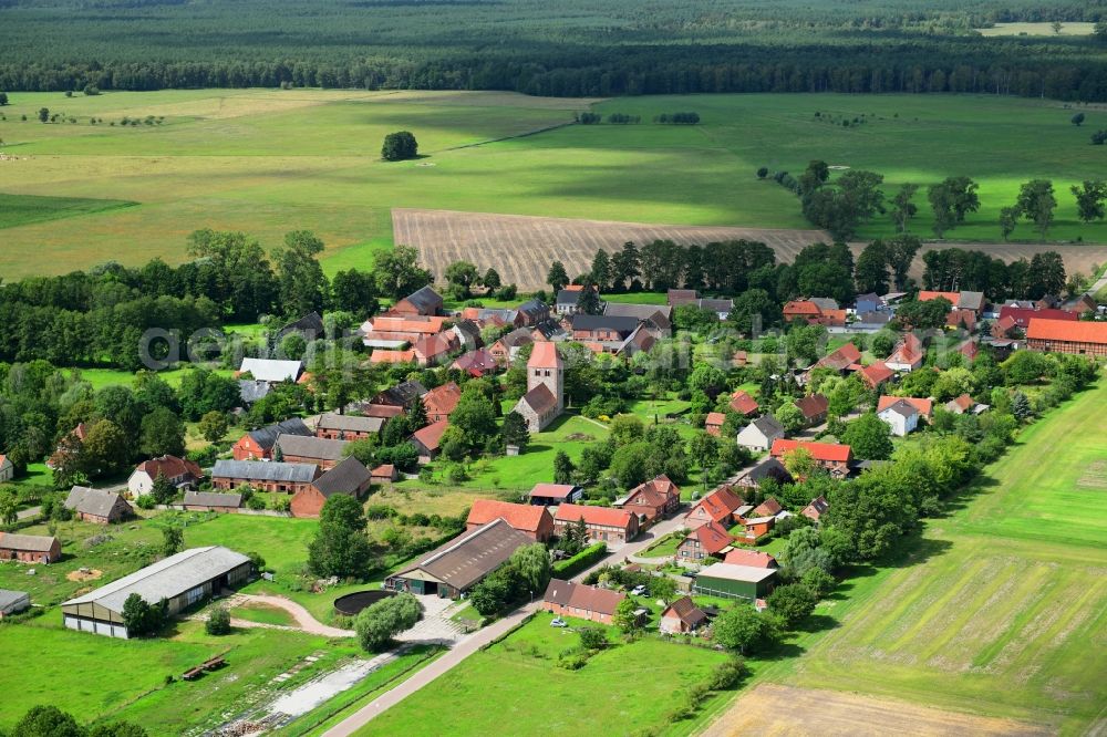 Groß Leppin from the bird's eye view: Agricultural land and field borders surround the settlement area of the village in Gross Leppin in the state Brandenburg, Germany