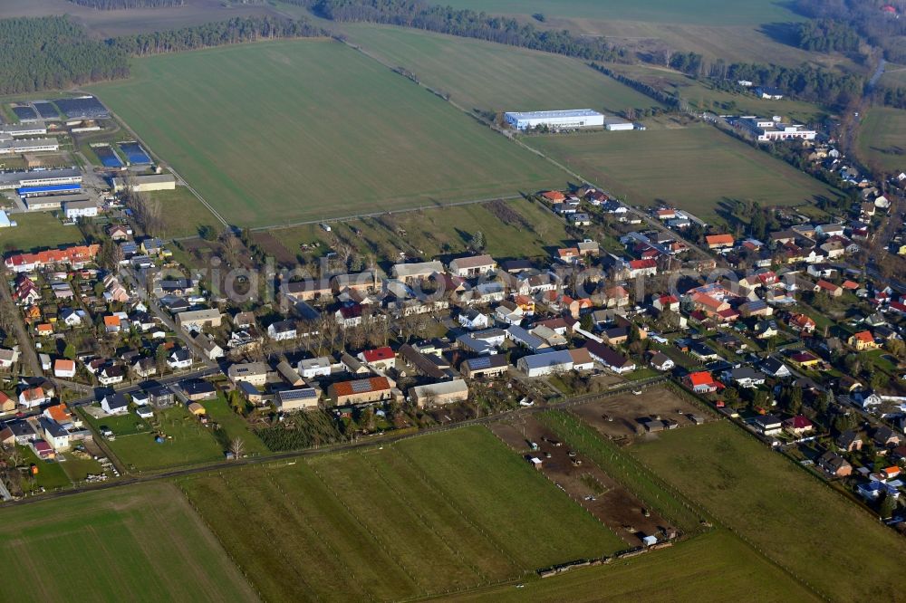 Groß Schulzendorf from above - Agricultural land and field borders surround the settlement area of the village in Gross Schulzendorf in the state Brandenburg, Germany