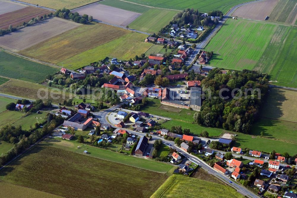 Gross Sisbeck from above - Agricultural land and field borders surround the settlement area of the village in Gross Sisbeck in the state Lower Saxony, Germany