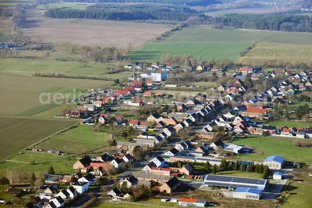 Aerial photograph Großwoltersdorf - Agricultural land and field borders surround the settlement area of the village in Grosswoltersdorf in the state Brandenburg, Germany