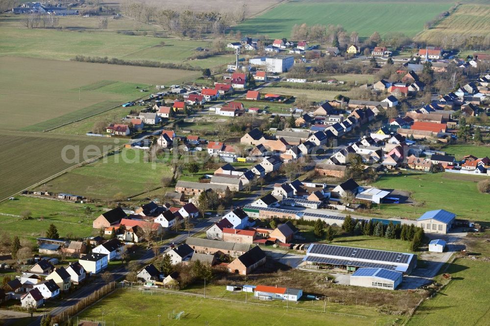 Großwoltersdorf from above - Agricultural land and field borders surround the settlement area of the village in Grosswoltersdorf in the state Brandenburg, Germany
