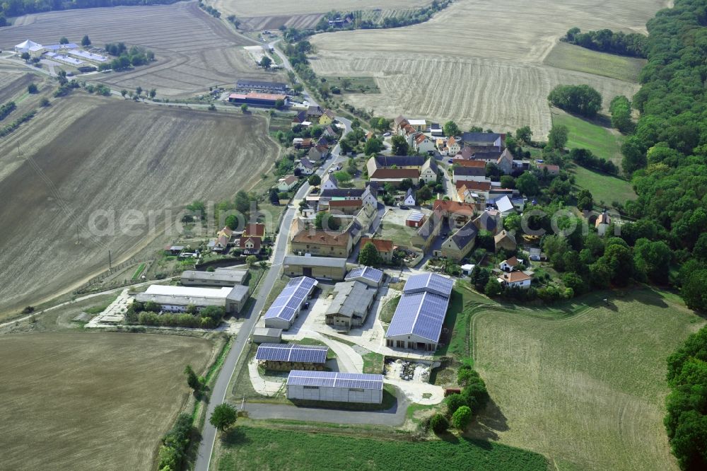 Aerial photograph Größnitz - Agricultural land and field borders surround the settlement area of the village in Groessnitz in the state Saxony-Anhalt, Germany
