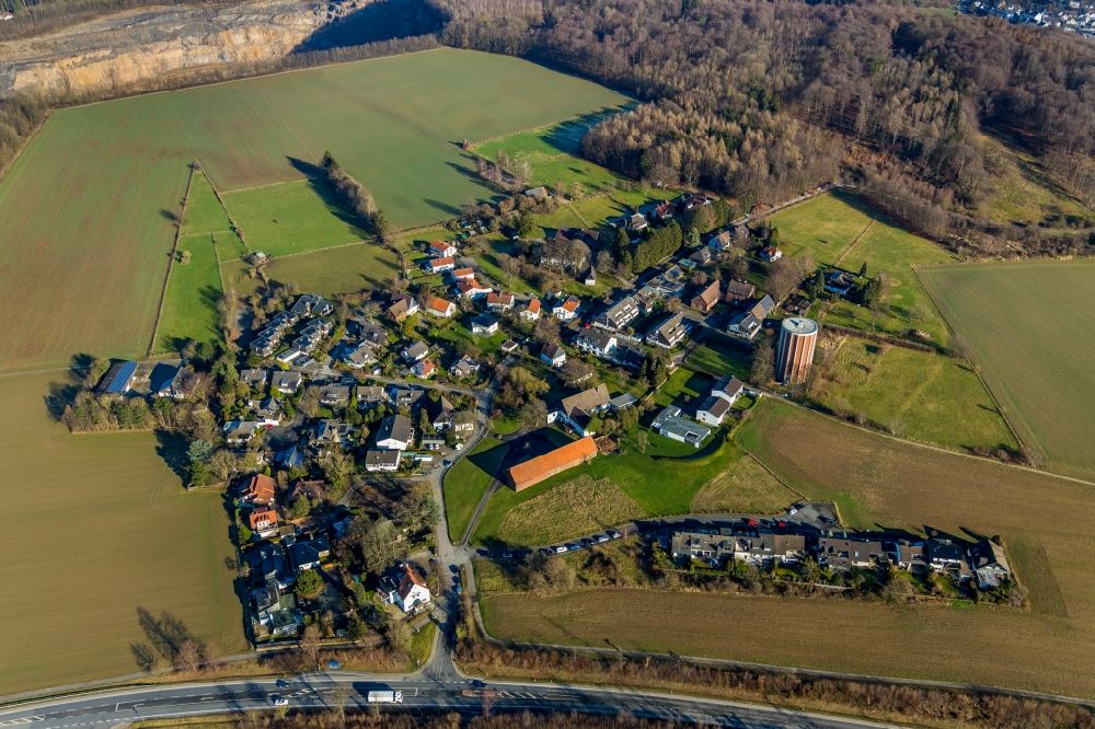 Aerial photograph Haßley - Agricultural land and field borders surround the settlement area of the village in Hassley in the state North Rhine-Westphalia, Germany