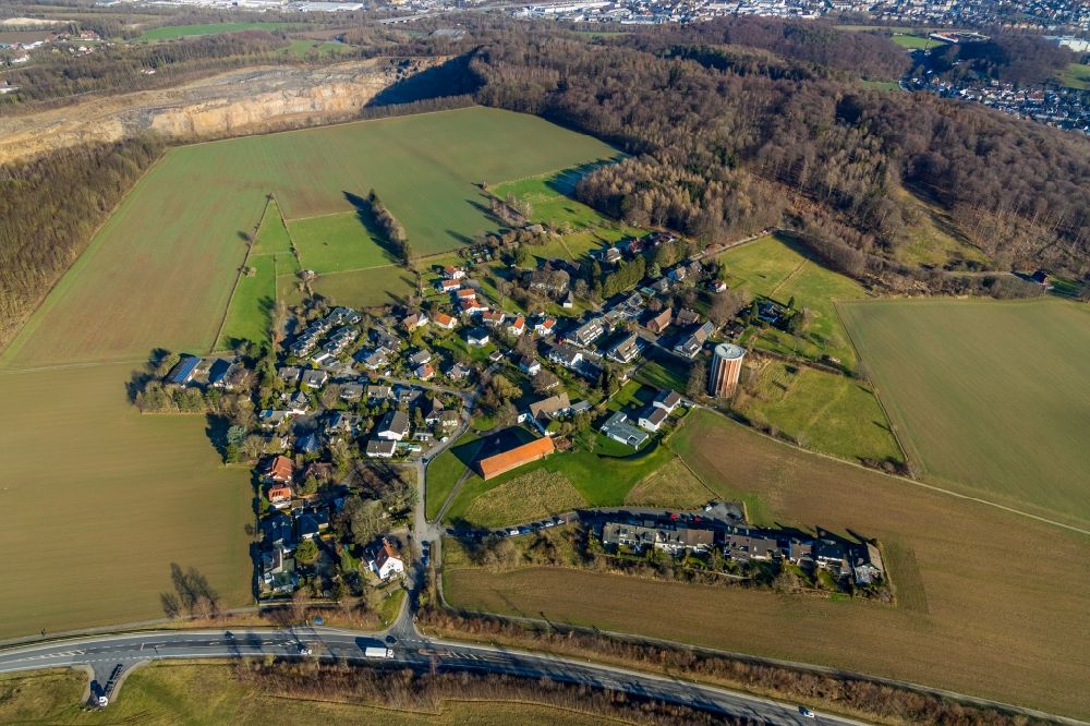 Haßley from above - Agricultural land and field borders surround the settlement area of the village in Hassley in the state North Rhine-Westphalia, Germany
