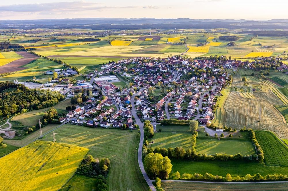Aerial image Hochmössingen - Agricultural land and field borders surround the settlement area of the village in Hochmoessingen in the state Baden-Wurttemberg, Germany