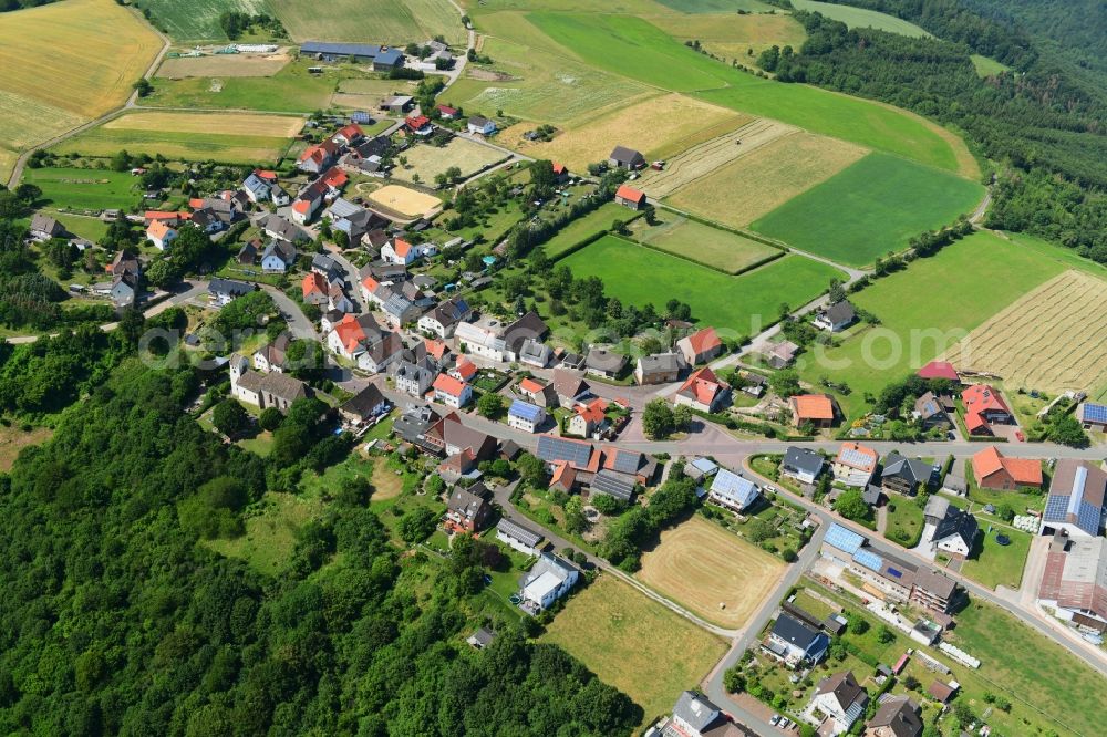 Jakobsberg from above - Agricultural land and field borders surround the settlement area of the village in Jakobsberg in the state North Rhine-Westphalia, Germany
