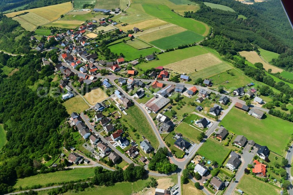 Jakobsberg from the bird's eye view: Agricultural land and field borders surround the settlement area of the village in Jakobsberg in the state North Rhine-Westphalia, Germany