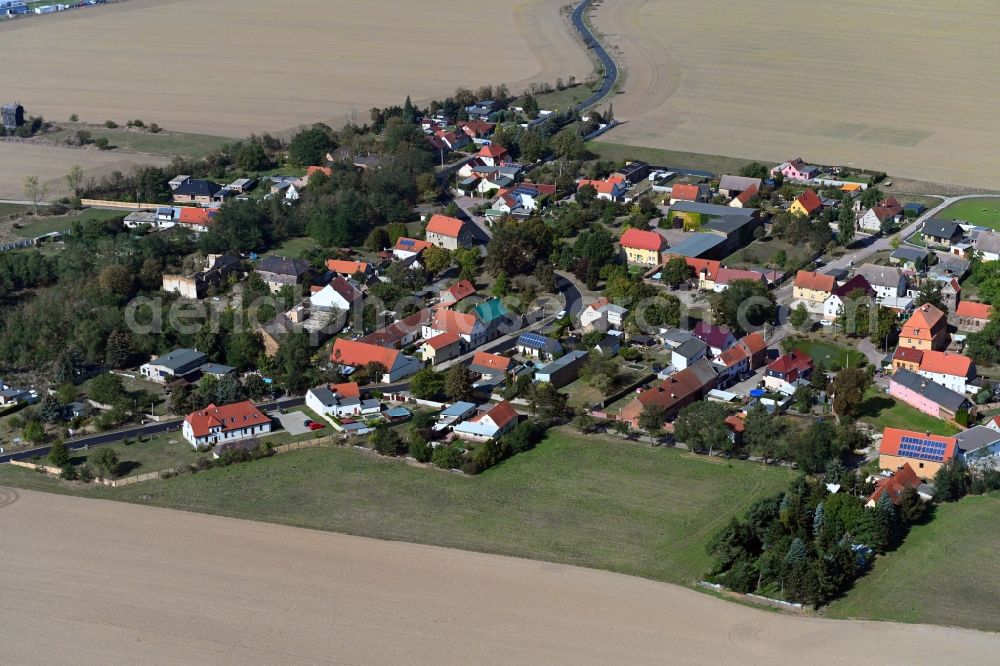 Aerial image Köckern - Agricultural land and field borders surround the settlement area of the village in Koeckern in the state Saxony-Anhalt, Germany
