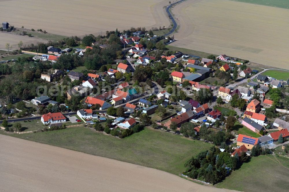 Aerial photograph Köckern - Agricultural land and field borders surround the settlement area of the village in Koeckern in the state Saxony-Anhalt, Germany