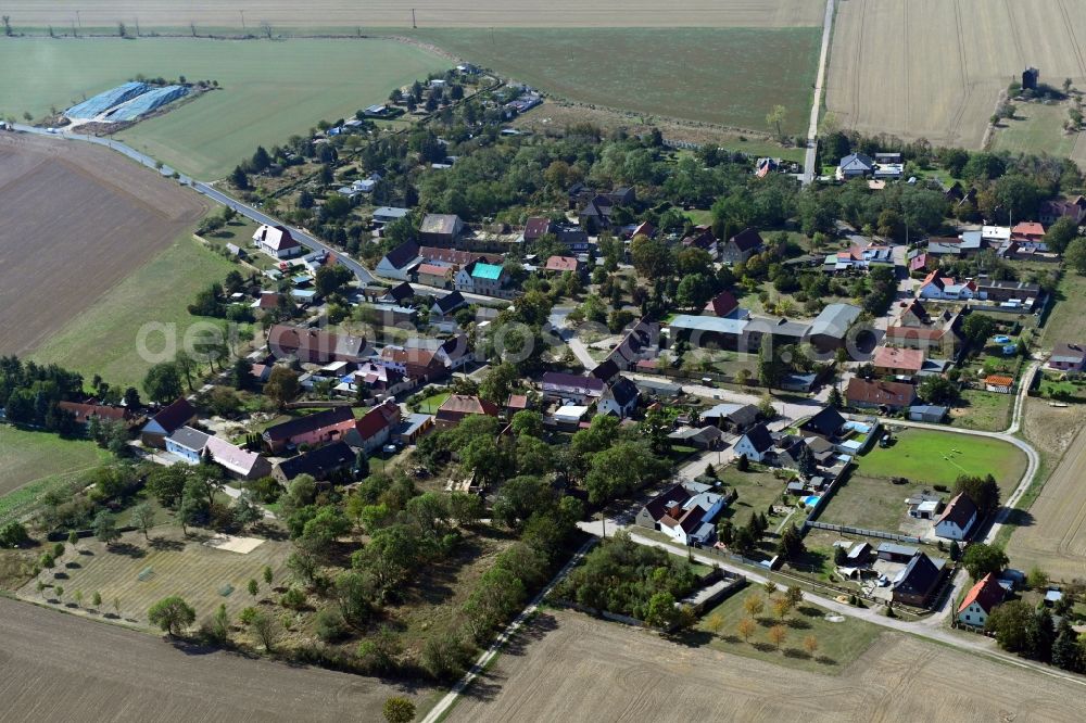 Aerial image Köckern - Agricultural land and field borders surround the settlement area of the village in Koeckern in the state Saxony-Anhalt, Germany