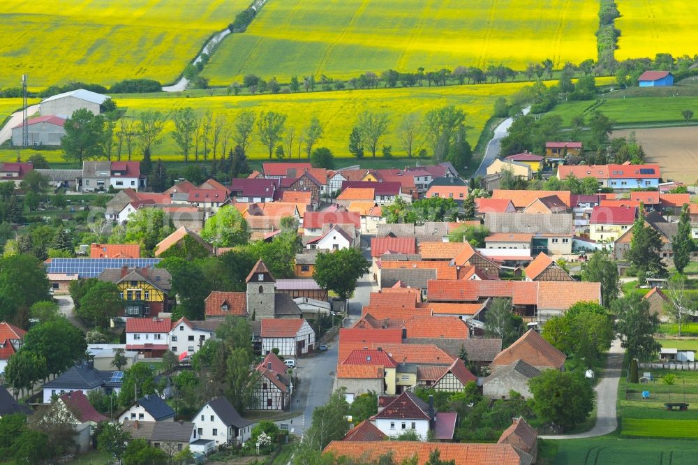 Kirchengel from above - Agricultural land and field borders surround the settlement area of the village in Kirchengel in the state Thuringia, Germany