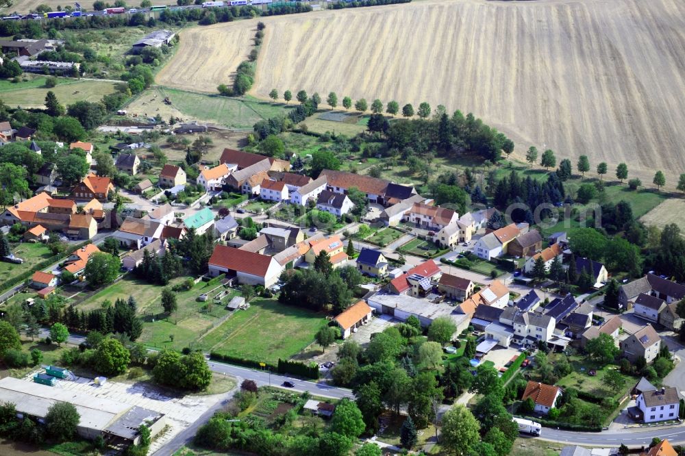 Aerial image Kleinhelmsdorf - Agricultural land and field borders surround the settlement area of the village in Kleinhelmsdorf in the state Saxony-Anhalt, Germany