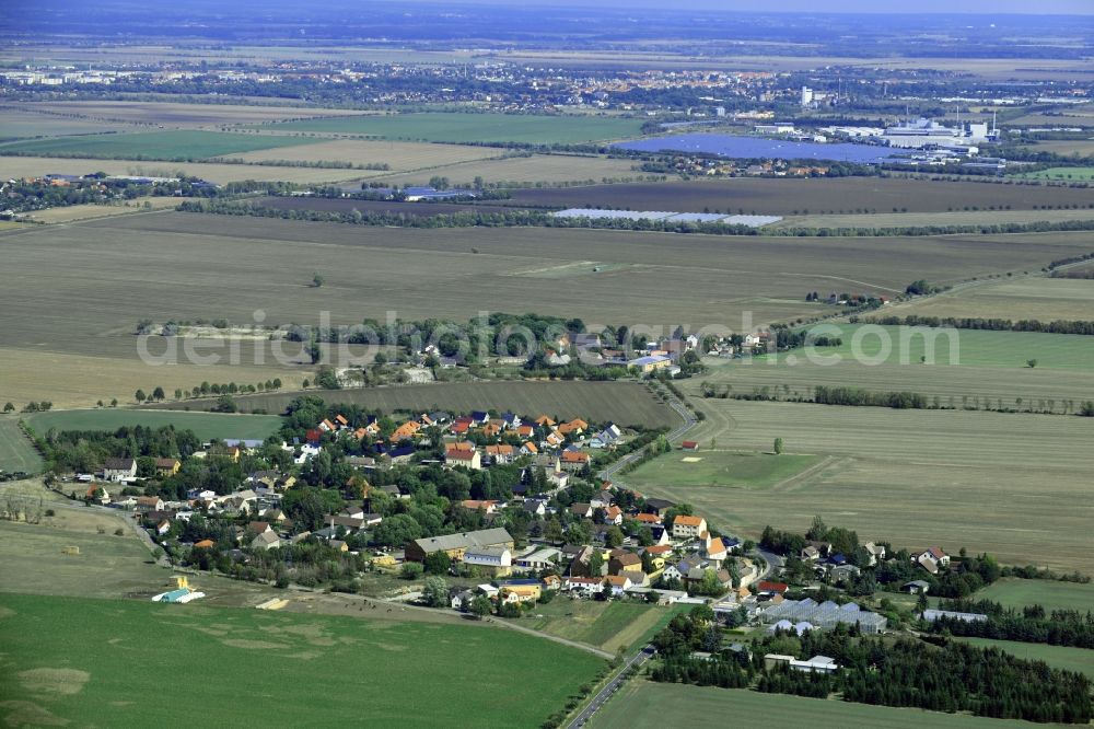 Klitschmar from the bird's eye view: Agricultural land and field borders surround the settlement area of the village in Klitschmar in the state Saxony, Germany