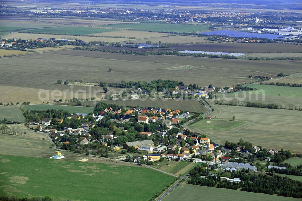 Aerial image Klitschmar - Agricultural land and field borders surround the settlement area of the village in Klitschmar in the state Saxony, Germany