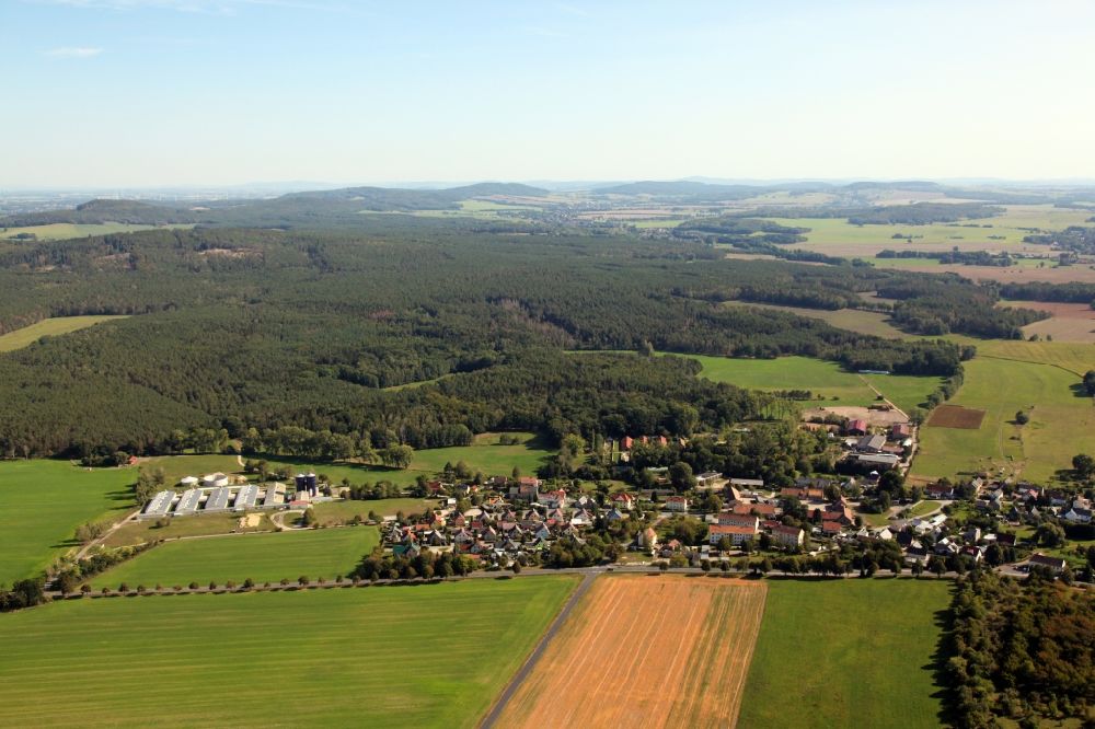 Aerial photograph Koitzsch - Agricultural land and field borders surround the settlement area of the village in Koitzsch in the state Saxony, Germany