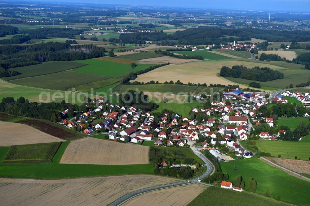 Lauterbach from the bird's eye view: Agricultural land and field borders surround the settlement area of the village in Lauterbach in the state Bavaria, Germany